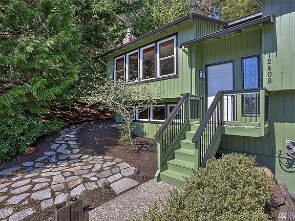 Updated vinyl windows throughout and perfectly placed stone pathway leads to a private, low maintenance back woodlands.  Beautiful, high quality exterior paint!