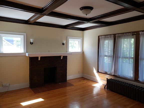 Living Room facing Northwest (windows to the right are to enclosed front porch). Fireplace can take a gas log.