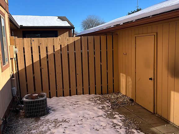 gated courtyard with outdoor storage room