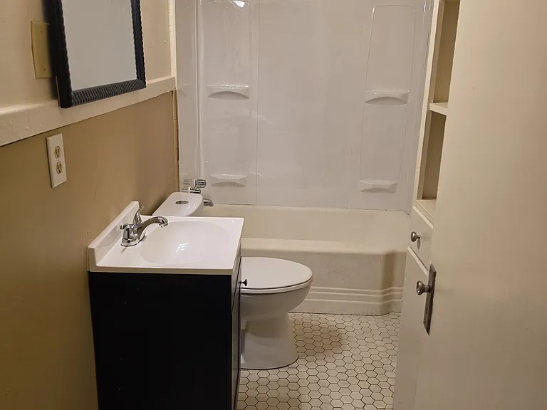 Bathroom with towel/linen shelves, Laundry drawer