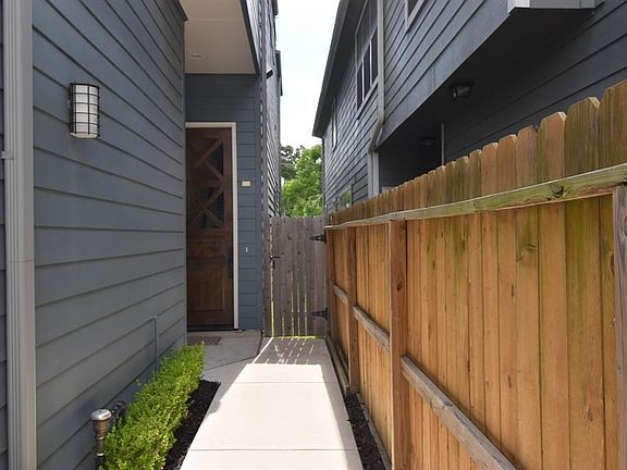 Landscaped entryway.  Home has irrigation system.