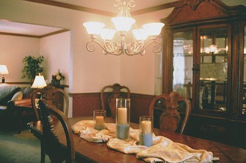 13x11 Formal dining room with upscale lighting & newer plush carpeting        