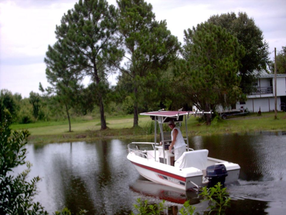 fishing on the pond. House in background