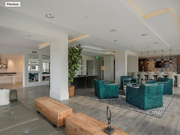 Lavishly appointed social room overlooking pool and spa