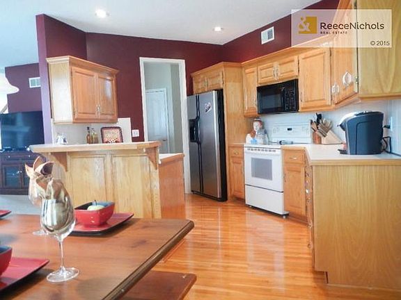 Chef's kitchen has plenty of counter space and raised island.