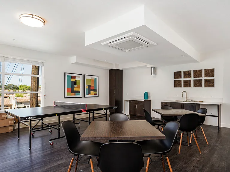 The Harrington interior room with ping pong and dining tables