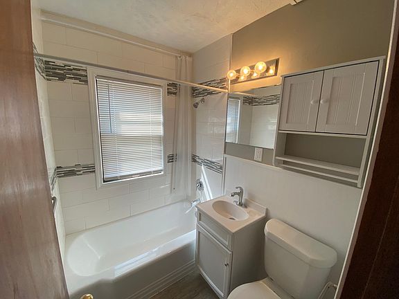 Updated tile, tub, finishes in bathroom