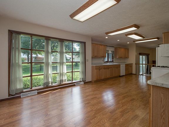 Newly remodeled large eat in kitchen with plenty of natural light.