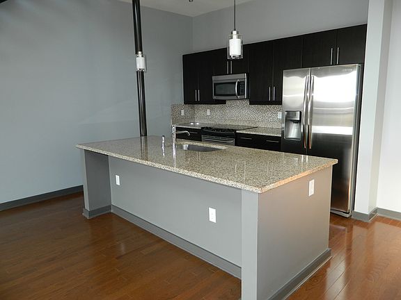 Gourmet kitchen with central island and breakfast bar