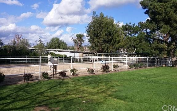 Large arena, turnout and several stalls, expansive grassy area, all usable acre