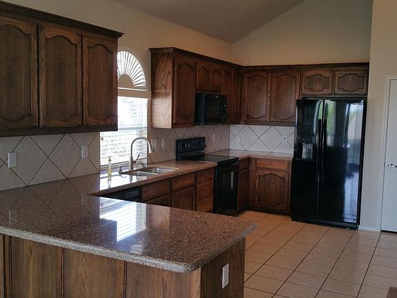 Kitchen with full compliment of appliances