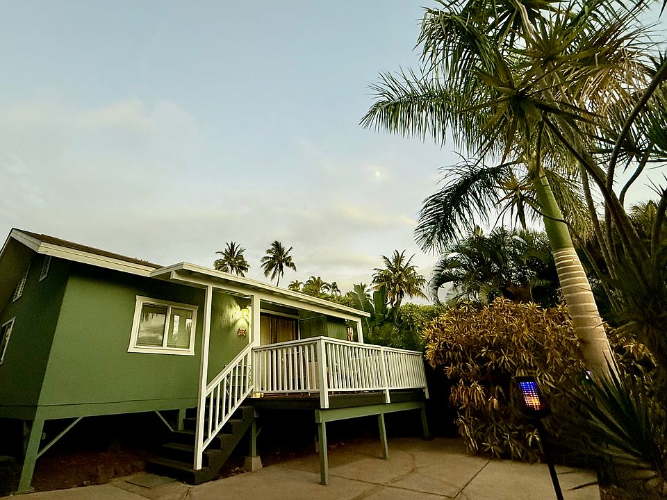 Front of cottage with parking space in front