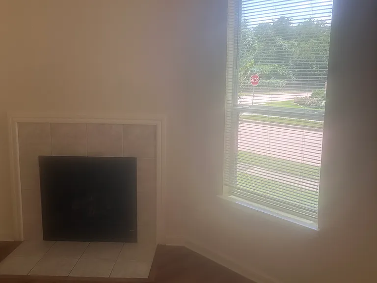 One of the four windows in the living room