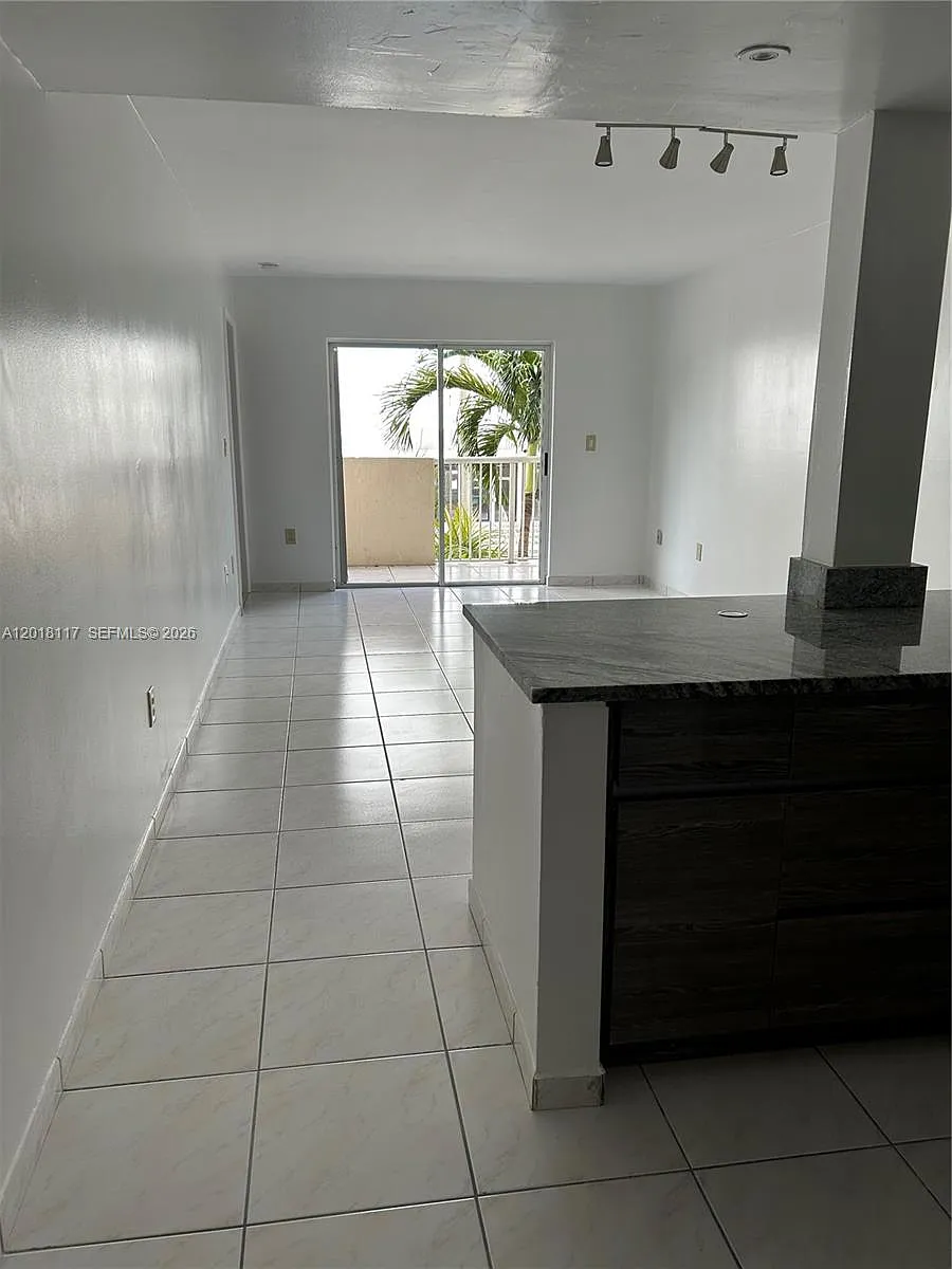 Building Photo - 6801 Harding Ave #201