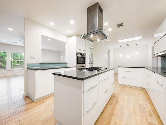 Kitchen with stainless steel appliances and new refrigerator. Lots of storage and counter space!