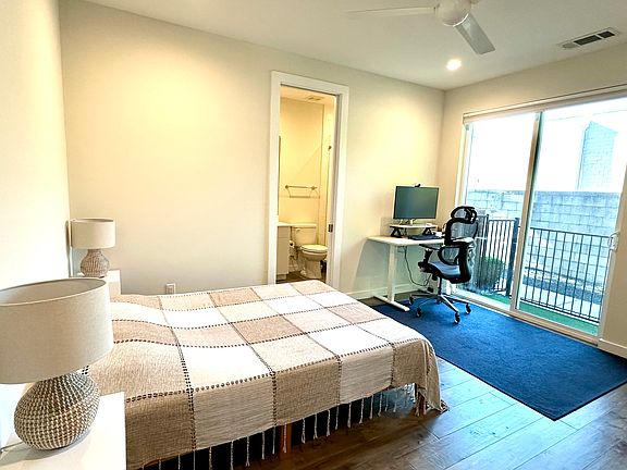 First floor en-suite bedroom also has access to turfed courtyard.