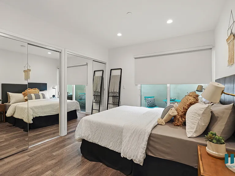 Bedroom with Two Mirrored Closets, Vinyl Flooring, Recessed Lighting, and Private Entrance