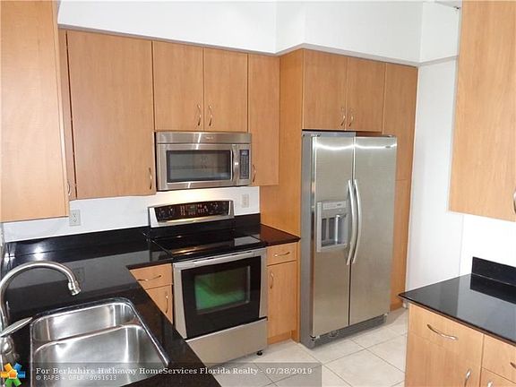 Kitchen with granite counters and stainless appliances.