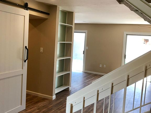 Entry towards Storage/Laundry on left and kitchen & den near the sliding doors to patio