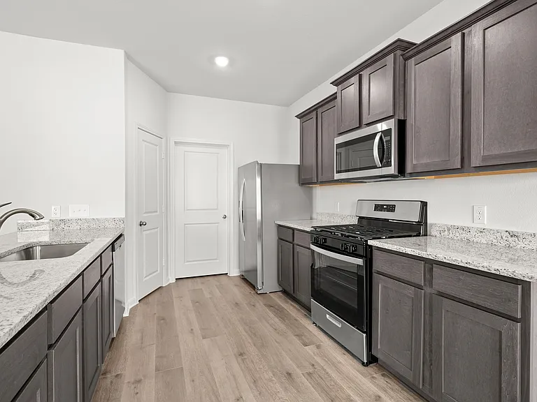 The kitcehn has stainless-steel, energy efficient appliances.