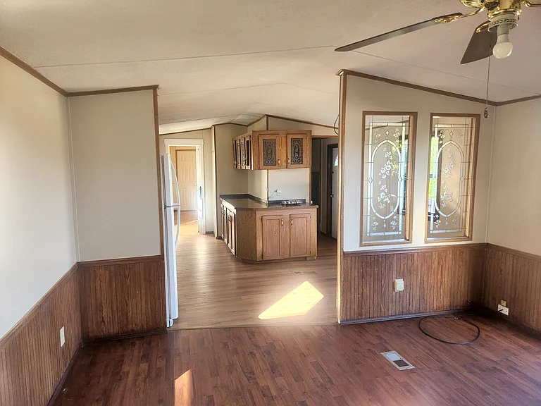 Living room looking to kitchen/dining room