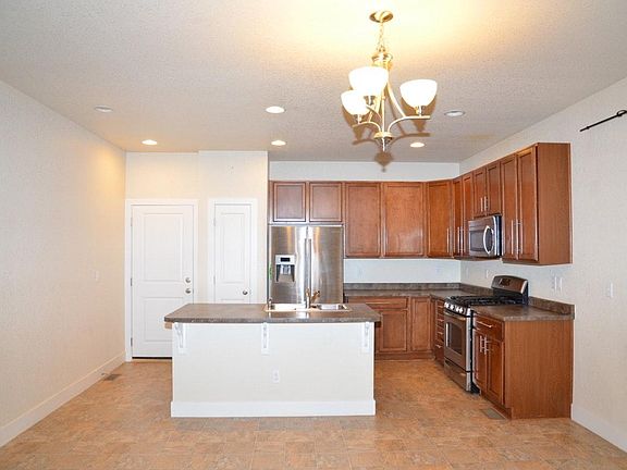 Open Kitchen with Stainless Steel appliances and gas stove