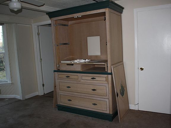 One side of living room with entertainment center (can be re