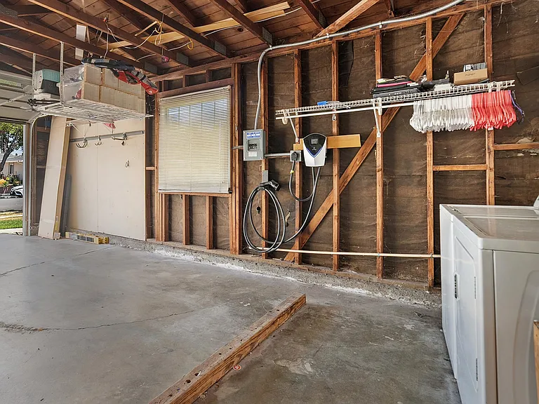 Garage with EV charger and washer and dryer (both included)