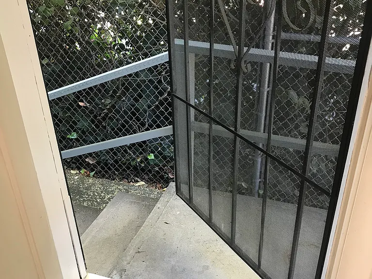 Back door down a few steps to your own garbage and recycle cans.