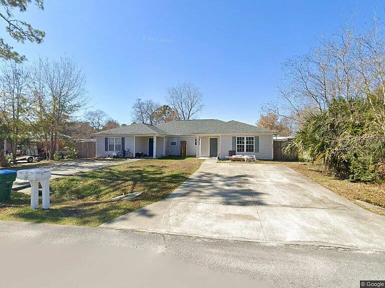 Google View - Front of Duplex. Privacy fence divides back yard between units.