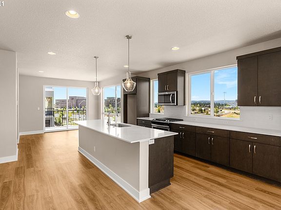 Kitchen with big island, view windows