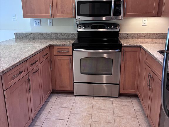 Plenty of storage in top and bottom kitchen cabinets.
