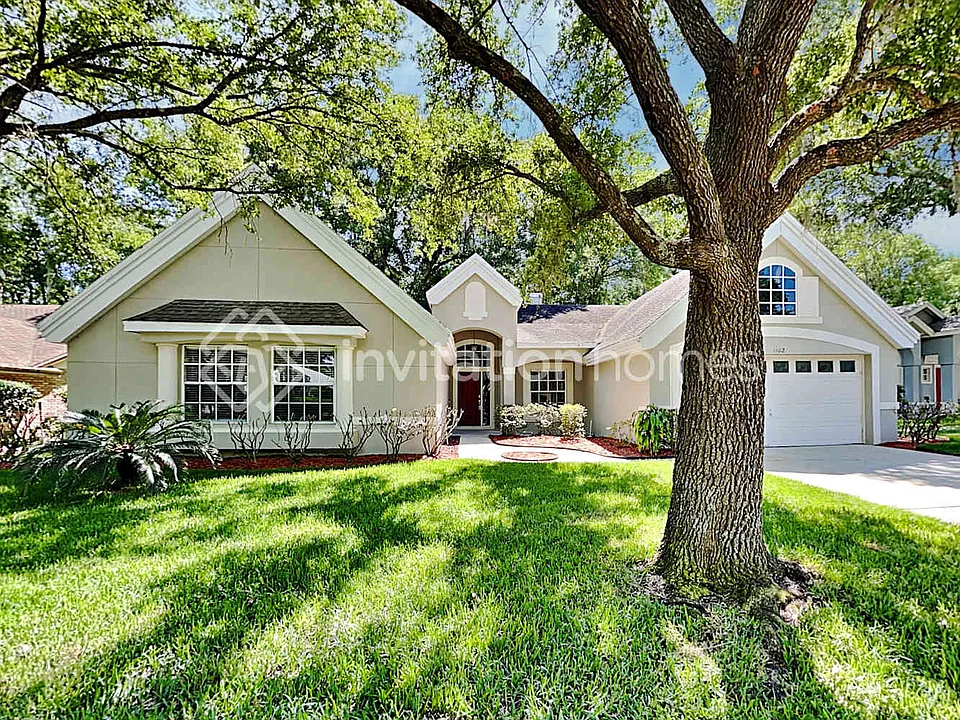 1402 Whispering Woods Way