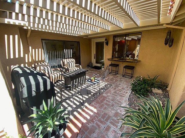 Private front courtyard with BBQ, breakfast bar and gas fire table.