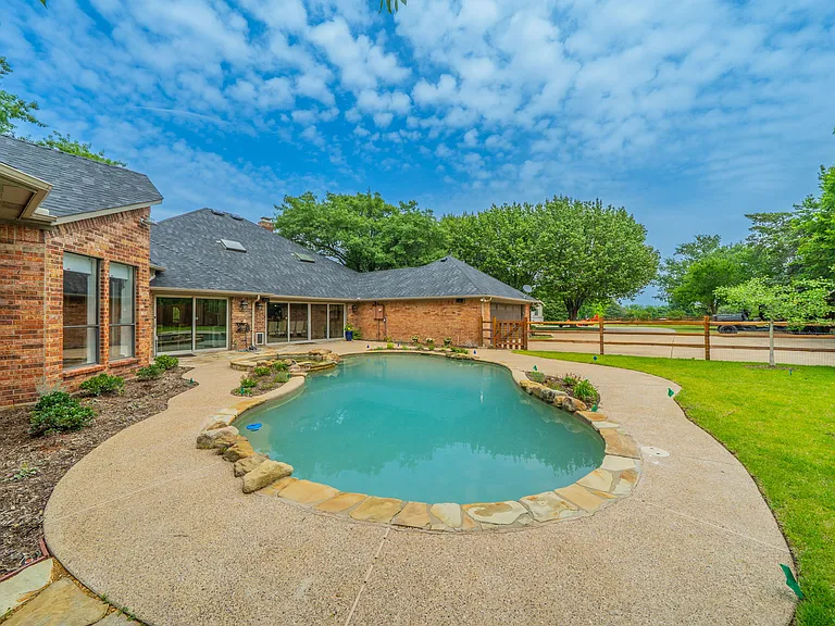 Poolside Serenity: Relax on the Sun-Drenched Patio with Garden Views