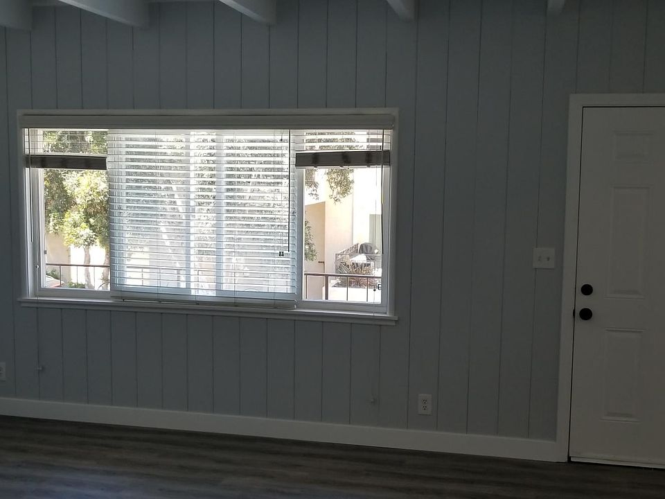 Bright and airy living room. Modern Gray d_cor with white trim
