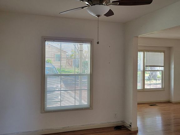 Living Room View Ceiling Fan and windows
