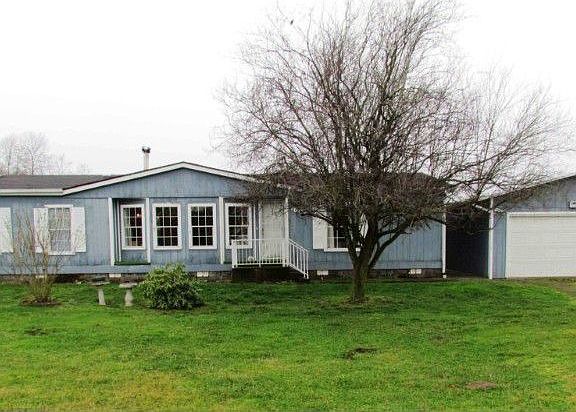 Affordable acreage with home and shop on 4.75 level acres in a very quiet setting with a Mt. Baker v
