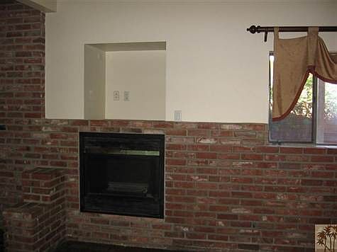 fireplace at other end of kitchen