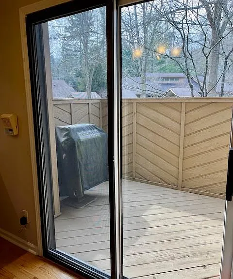 Side deck with gas grill and private outdoor eating space.