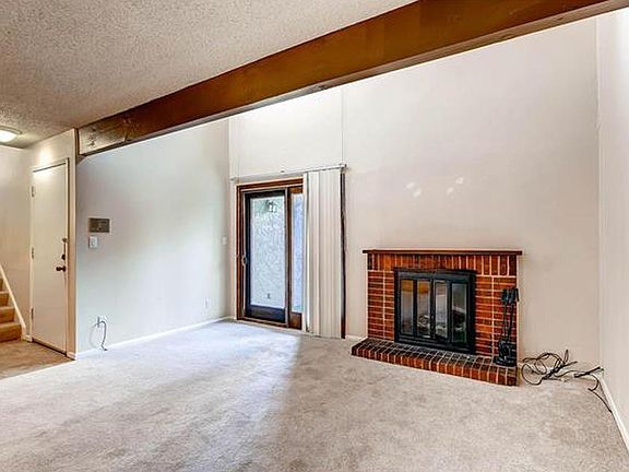 Entrance and living room. **Floors have been replaced with vinyl plank.**