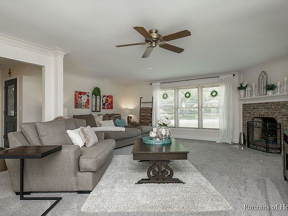 Huge living room with cozy gas log fireplace.