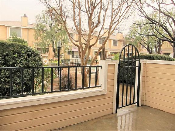 Private patio open to the pool area.