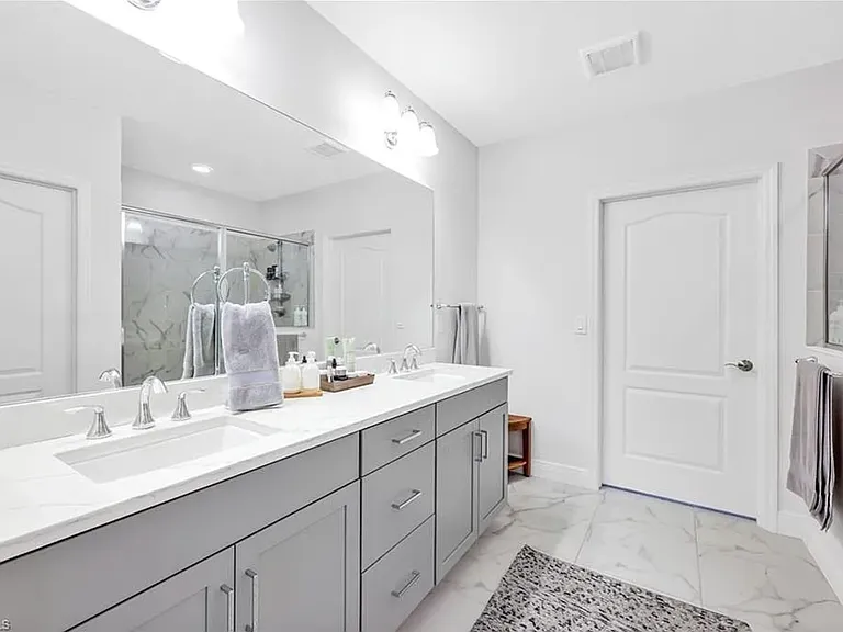 Dual sinks in main bathroom off of main king bedroom