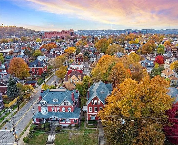 Aerial view of house and neighborhood.