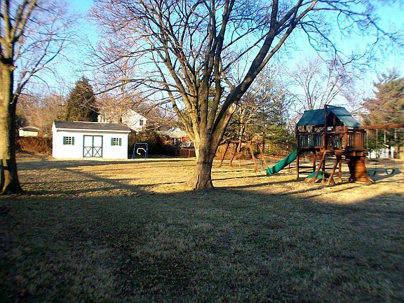 Large rear fenced yard with oversized shed