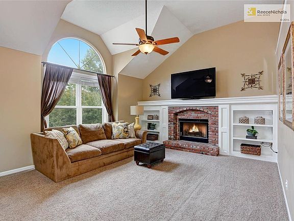 Entertain in style in the vaulted great room with gas log fireplace and built-ins.