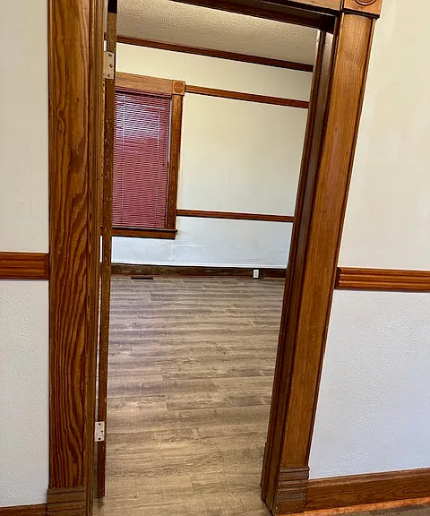 looking into master bedroom (separated from bedrooms 2 & 3) from living room