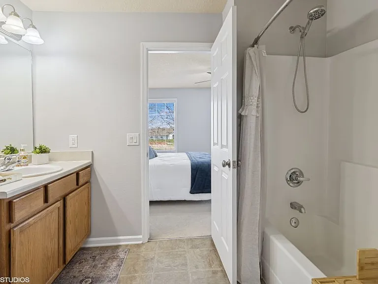 Master room bathroom, with tub. hairdryer, walk-in closet.