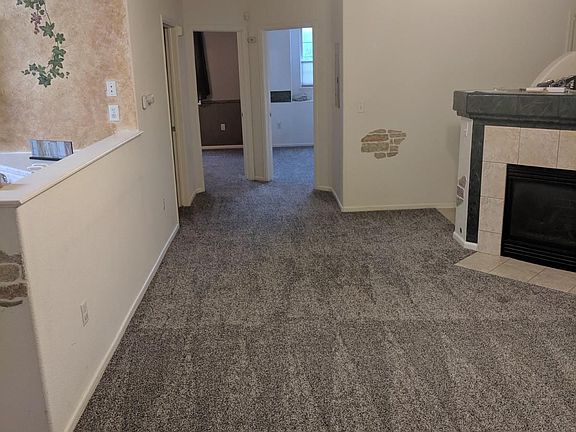 Main living room and fireplace. New Carpet!